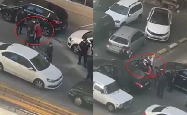 МВД прокомментировало видеокадры, где сотрудники полиции насильно сажают в автомобиль женщину - ВИДЕО