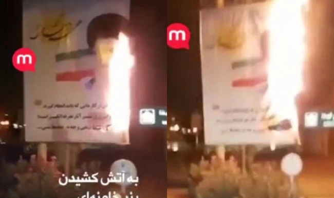 Иранские протестующие сжигают баннеры с изображением Хаменеи - ВИДЕО