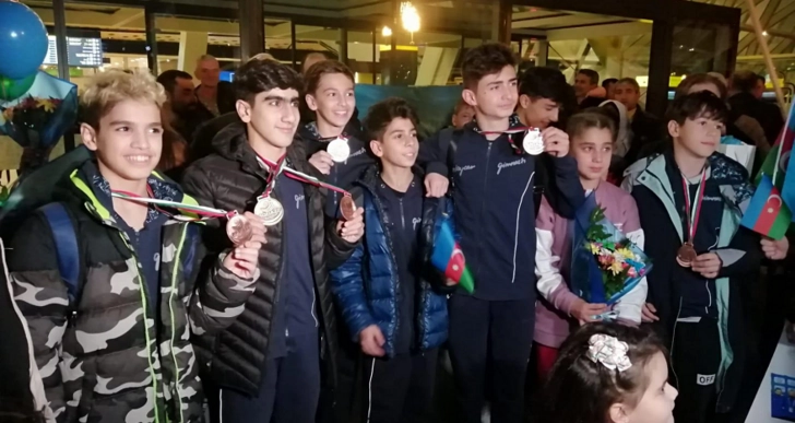 Азербайджанские гимнасты вернулись на родину - ФОТО