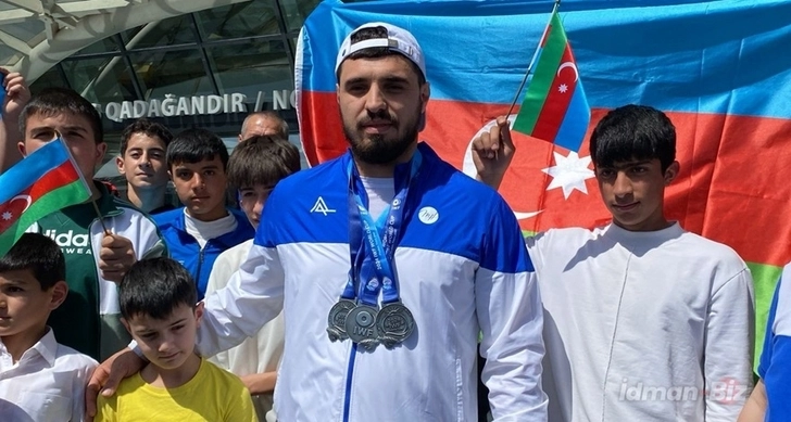 Сборная Азербайджана по тяжелой атлетике вернулась на родину - ВИДЕО
